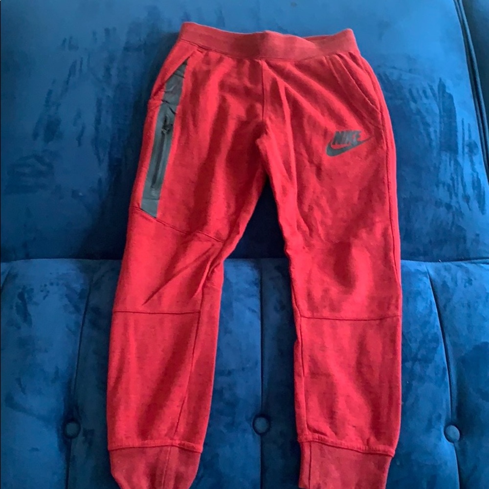 Red Nike jogging pants